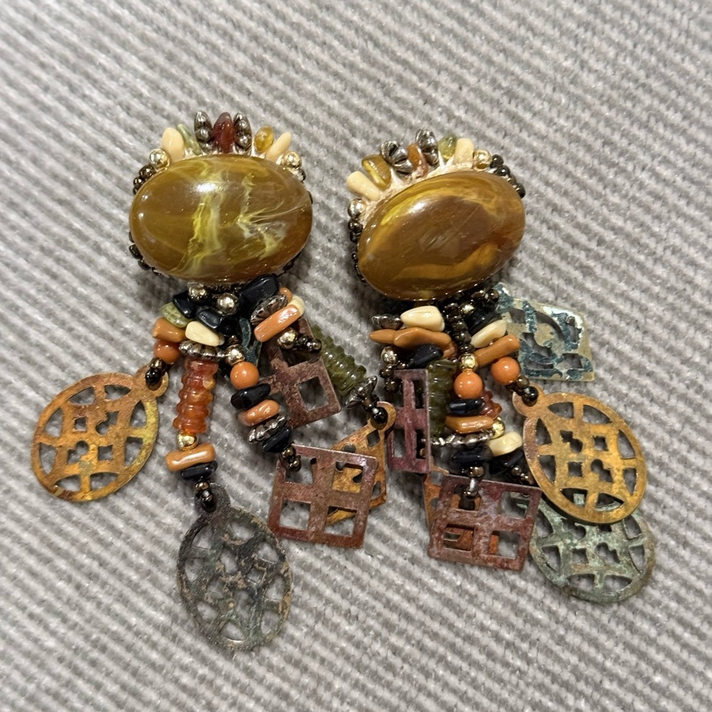 a pair of neutral tone beaded dangle earrings by Chipita, likely from the 1980s